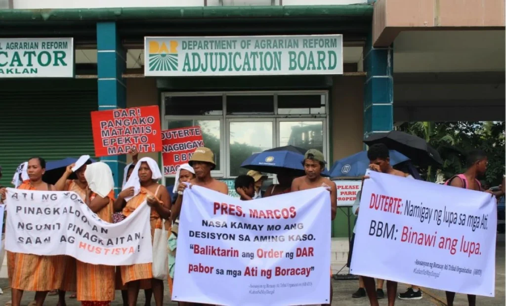 ATI people protest at the provincial office of the Department of Agrarian Reform DAR in Kalibo Aklan on March 16. Ro Sueo Pub 1