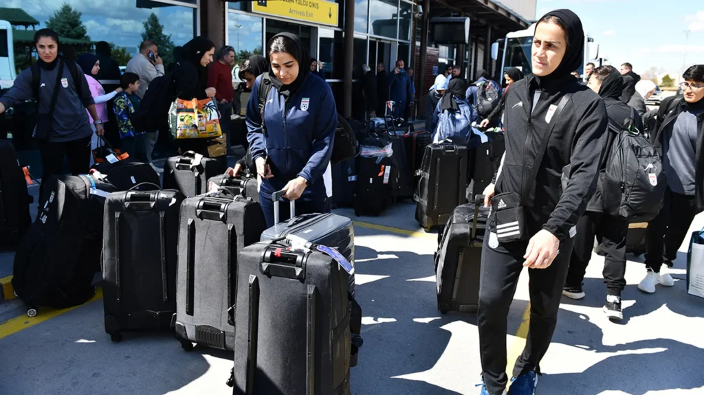Members of Iran's women's soccer team exit Igdir airport, waiting to reach Dogubeyazit, in Igdir March 18, 2026. (Ali Ihsan Ozturk/AFP via Getty Images)